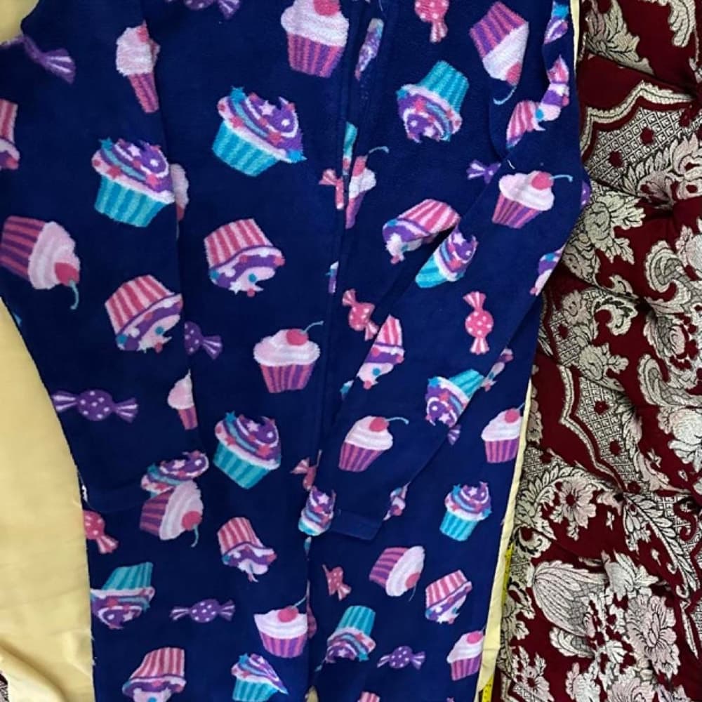 Cupcake onesie with pink, purple, and blue cupcakes