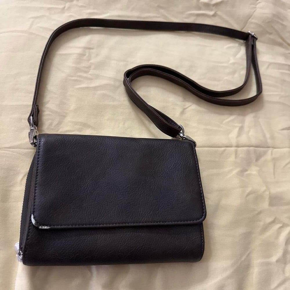 Black leather crossbody bag with textured surface