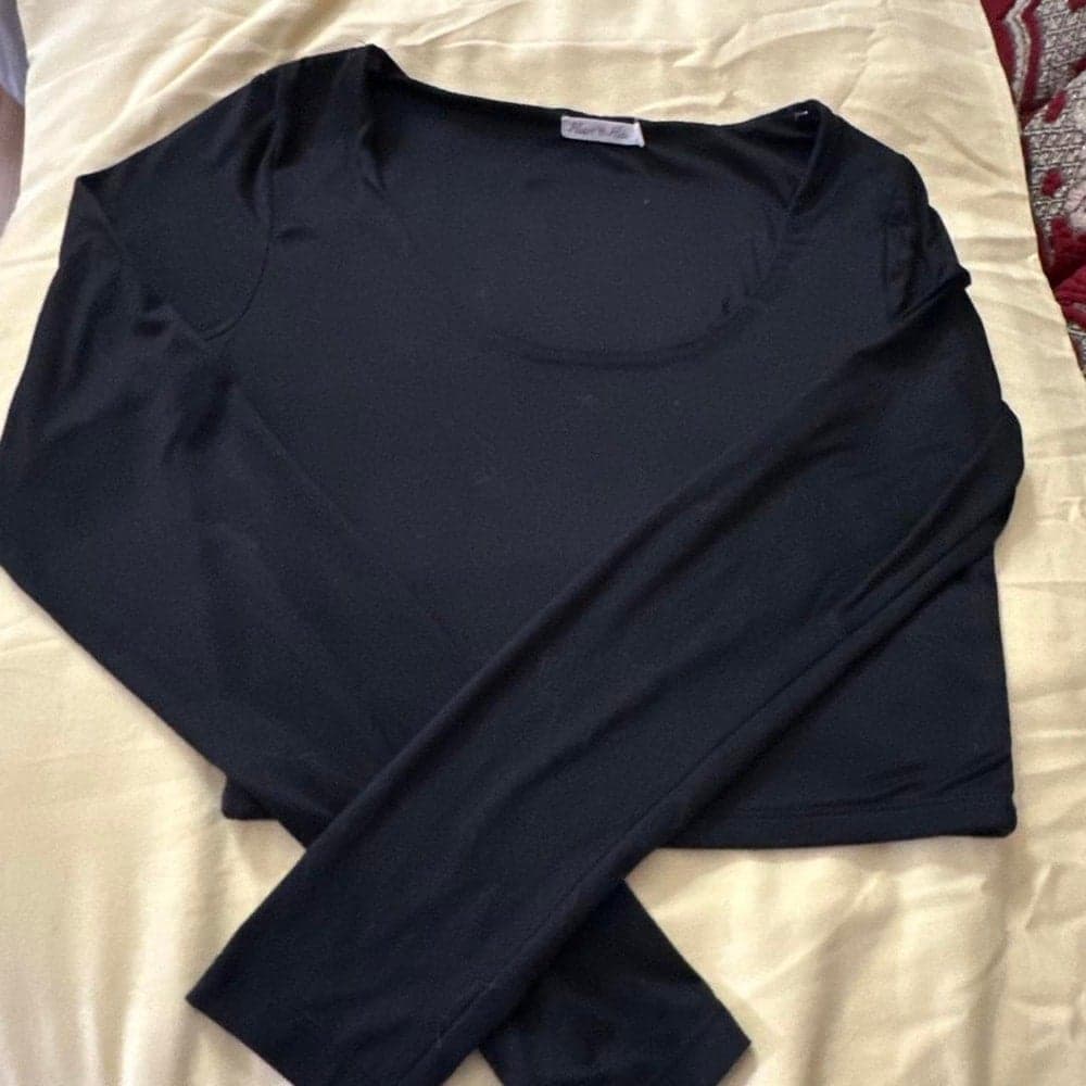 Black long sleeve top with a square neckline