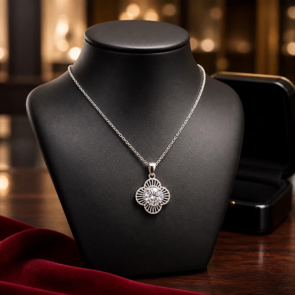 Silver pendant necklace with floral design and