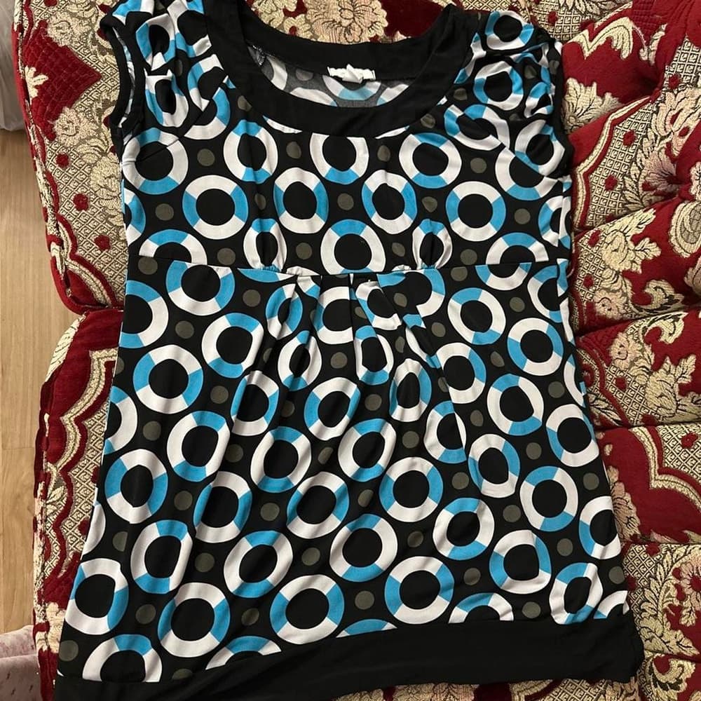 white and blue circle print babydoll top with black