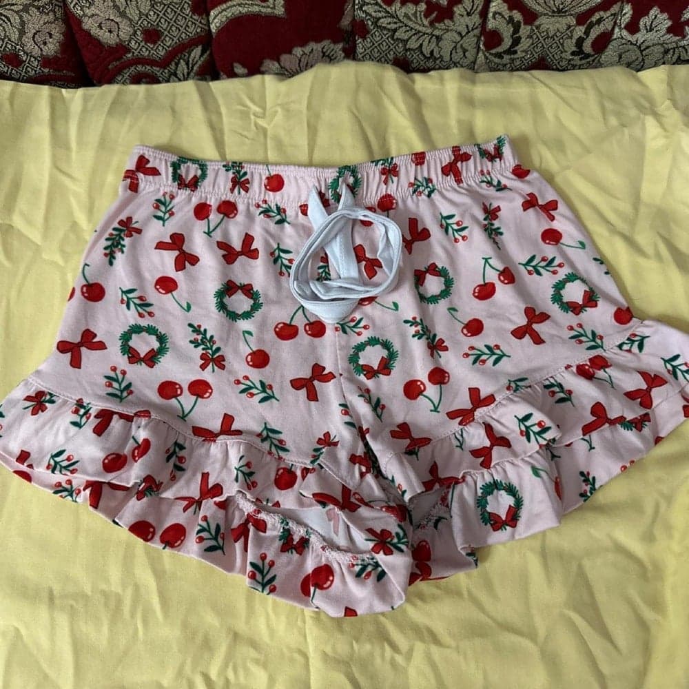 Pink Christmas-themed one-piece swimsuit with red