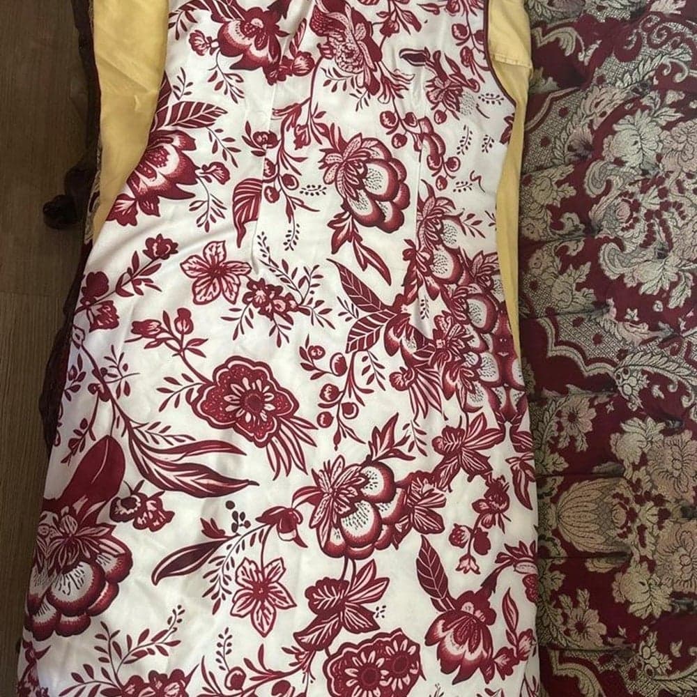 Red floral print dress with white background